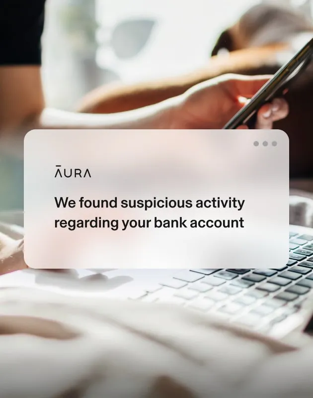 A pair of hands, — one at a laptop, the other using a phone — next to Aura popups about SSN and bank account activity